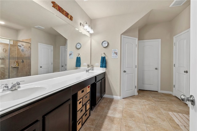 10343 Rosalina Loop, Converse, TX 78109 - bathroom with double vanity, a shower stall, and tile patterned floors