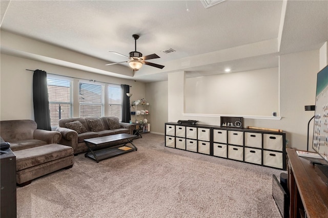 10343 Rosalina Loop, Converse, TX 78109 - living room featuring carpet flooring, ceiling fan, and a raised ceiling