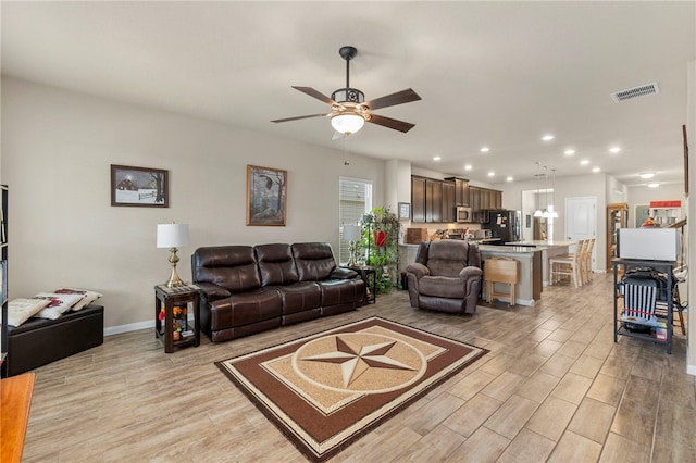 10343 Rosalina Loop, Converse, TX 78109 - living area with recessed lighting, a ceiling fan, and light wood finished floors