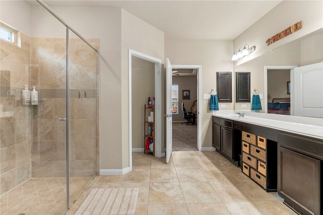 10343 Rosalina Loop, Converse, TX 78109 - full bathroom with ensuite bathroom, vanity, a stall shower, and tile patterned floors