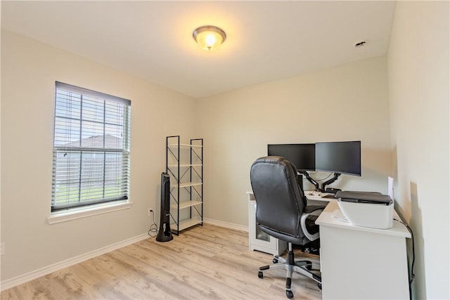 office space featuring light wood finished floors and baseboards