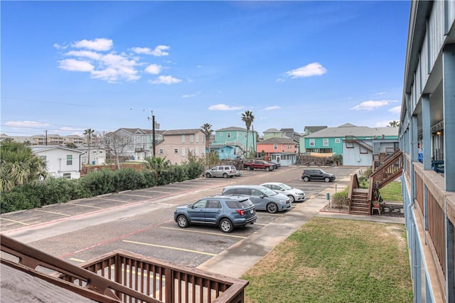 uncovered parking lot with a residential view