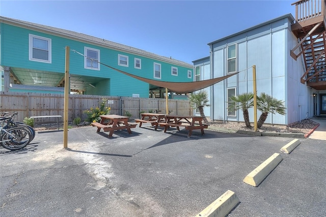 view of patio featuring outdoor dining area and fence