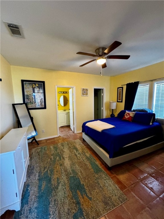 bedroom with ensuite bathroom and ceiling fan