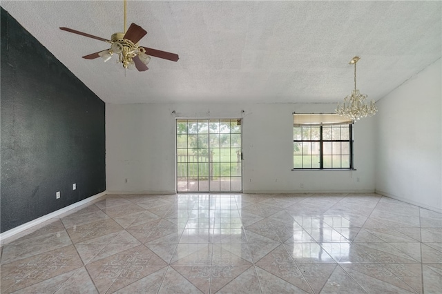 tiled spare room with ceiling fan with notable chandelier, lofted ceiling, and a textured ceiling