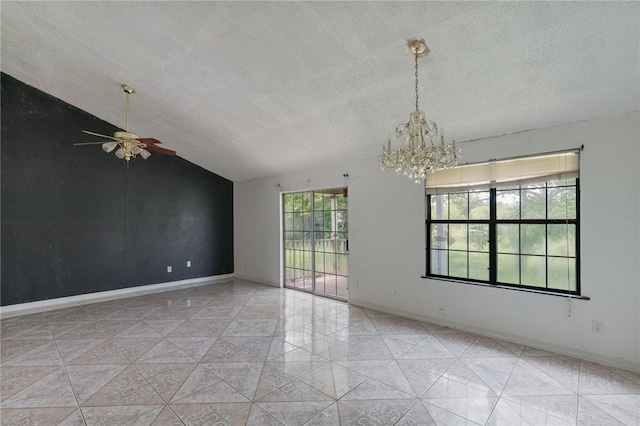 empty room featuring ceiling fan with notable chandelier, lofted ceiling, and a textured ceiling