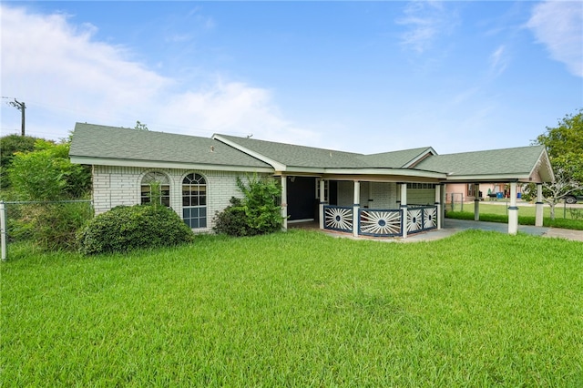 ranch-style home with a patio area and a front lawn