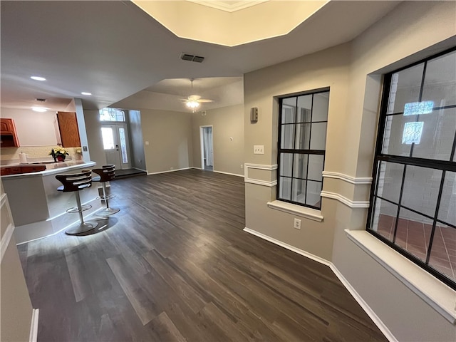 interior space featuring ceiling fan, dark hardwood / wood-style flooring, and french doors