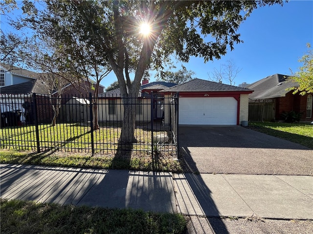 single story home with a garage and a front lawn