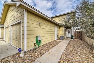 view of side of home featuring a garage