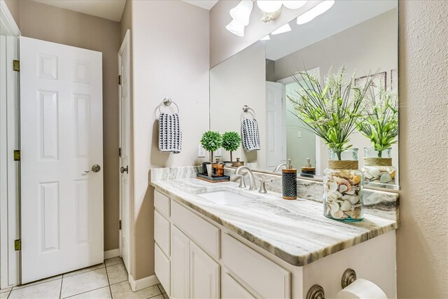 14970 Topgallant St, Corpus Christi, TX 78418 - bathroom with vanity, tile patterned floors, and a chandelier