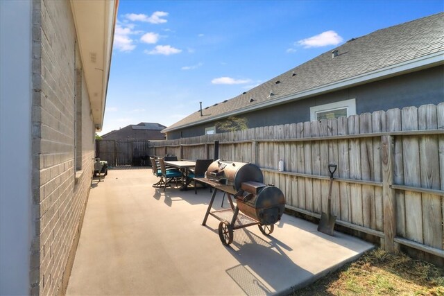 14970 Topgallant St, Corpus Christi, TX 78418 - fenced backyard featuring a patio area and outdoor dining space