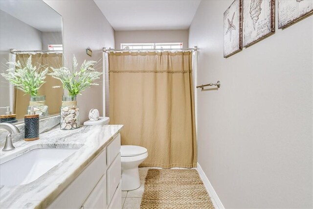 14970 Topgallant St, Corpus Christi, TX 78418 - bathroom with toilet, vanity, tile patterned flooring, and curtained shower