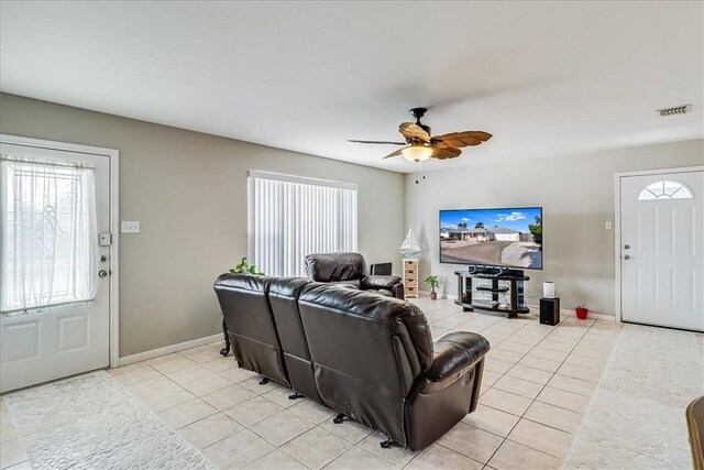 14970 Topgallant St, Corpus Christi, TX 78418 - living area with light tile patterned flooring, a ceiling fan, and baseboards