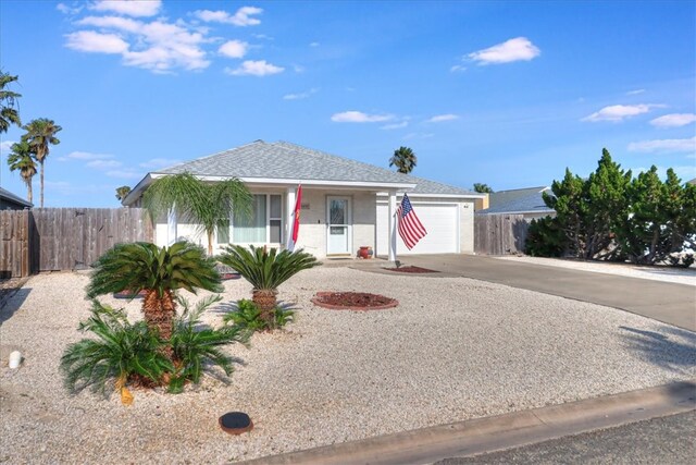 14970 Topgallant St, Corpus Christi, TX 78418 - view of front of home with driveway, a garage, and covered porch