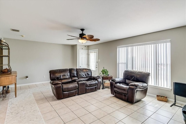14970 Topgallant St, Corpus Christi, TX 78418 - living room featuring light tile patterned floors, a ceiling fan, and baseboards