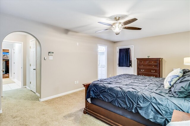 14970 Topgallant St, Corpus Christi, TX 78418 - bedroom with arched walkways, carpet floors, baseboards, and a ceiling fan