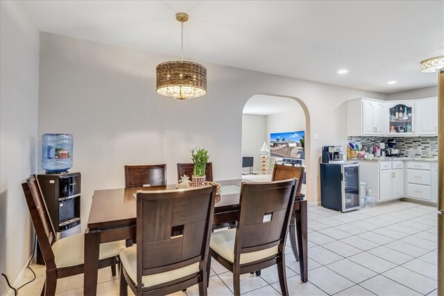 14970 Topgallant St, Corpus Christi, TX 78418 - dining area with arched walkways, light tile patterned floors, recessed lighting, and wine cooler