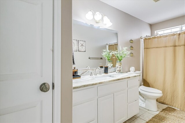 14970 Topgallant St, Corpus Christi, TX 78418 - bathroom featuring vanity, tile patterned floors, toilet, and a shower with shower curtain
