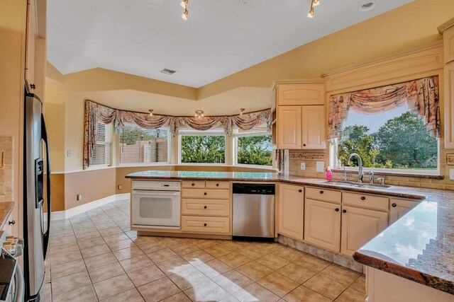 4950 Deer Park, Corpus Christi, TX 78413 - kitchen with dishwasher, oven, refrigerator with ice dispenser, a peninsula, and light tile patterned floors
