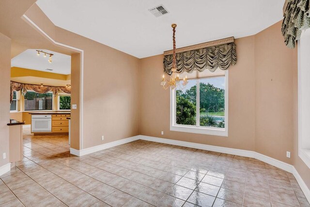 4950 Deer Park, Corpus Christi, TX 78413 - unfurnished room featuring a chandelier and light tile patterned floors