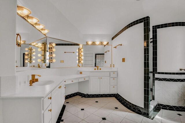 4950 Deer Park, Corpus Christi, TX 78413 - full bathroom with two vanities, tile patterned floors, and tiled shower