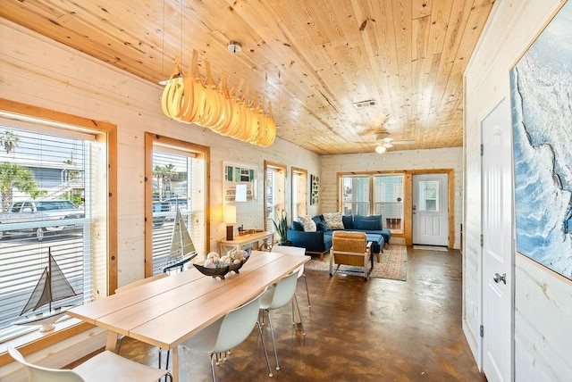 2120 S 11th St Unit 404, Port Aransas, TX 78373 - dining space with wooden ceiling and finished concrete flooring
