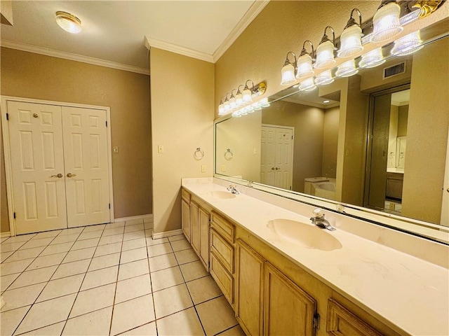 bathroom with vanity, tile patterned floors, ornamental molding, and toilet