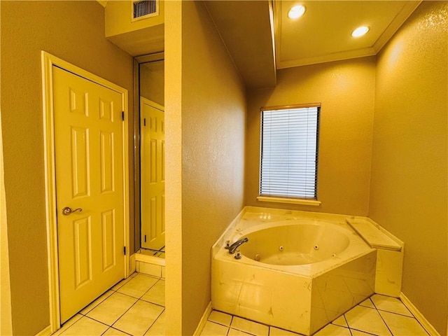 bathroom featuring crown molding, tile patterned floors, and a washtub