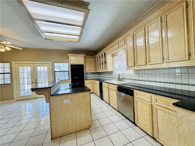 kitchen with light tile patterned flooring, sink, stainless steel dishwasher, a kitchen island, and black double oven