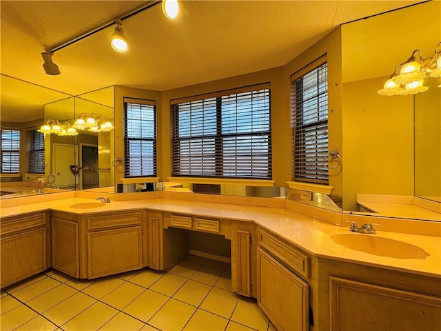 bathroom featuring tile patterned flooring and vanity