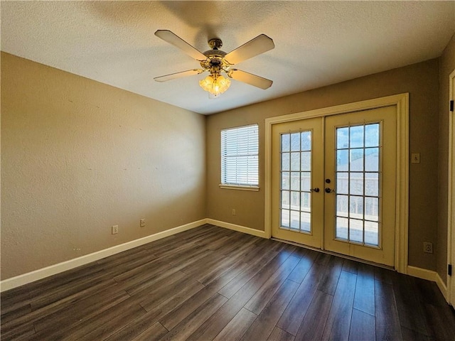 doorway to outside featuring ceiling fan, a textured ceiling, dark hardwood / wood-style flooring, and french doors