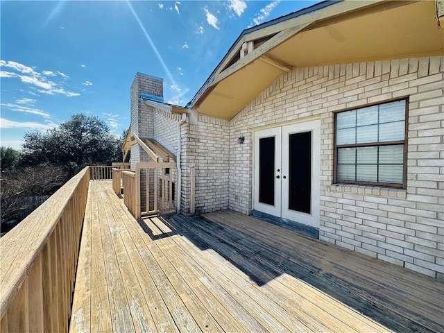 wooden deck featuring french doors