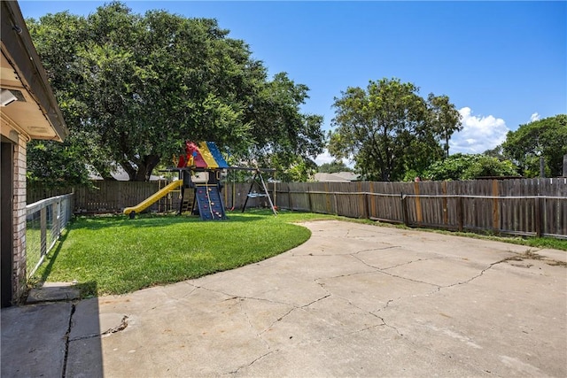 212 San Saba Dr, Portland, TX 78374 - view of patio featuring a fenced backyard and a playground