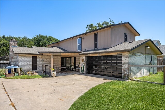 view of front facade with a garage and a front yard