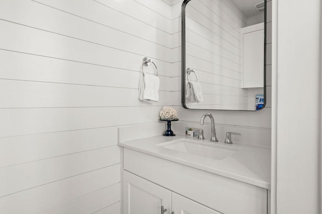 bathroom featuring visible vents and vanity