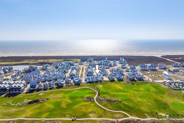 drone / aerial view featuring a residential view and a water view