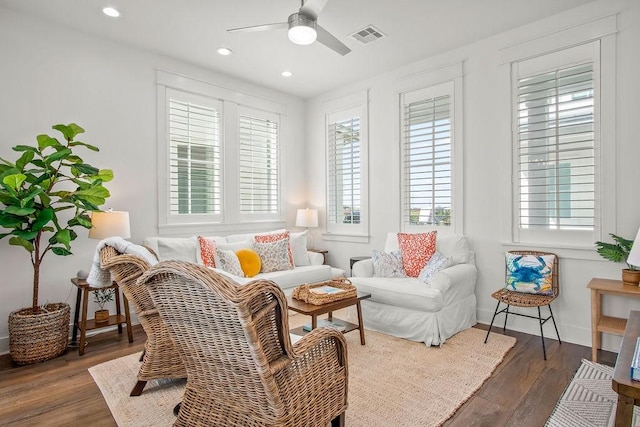 living area with visible vents, baseboards, ceiling fan, recessed lighting, and wood finished floors