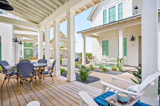 deck with outdoor dining area