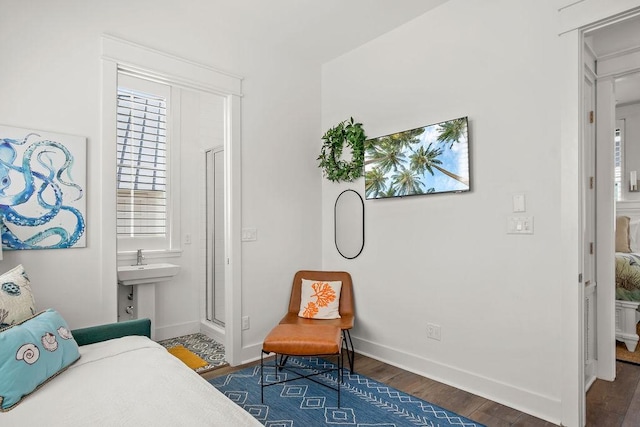 bedroom featuring baseboards and wood finished floors