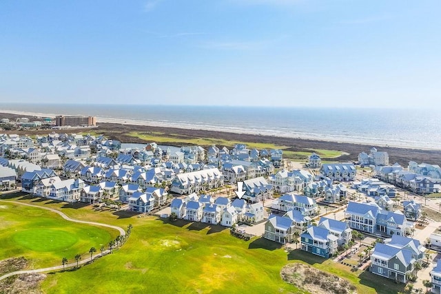 drone / aerial view with a residential view, a water view, and golf course view