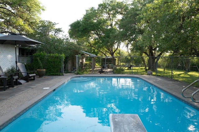 161 Red Bird Rdg, Beeville, TX 78102 - view of swimming pool featuring a fenced backyard, a diving board, and a patio area