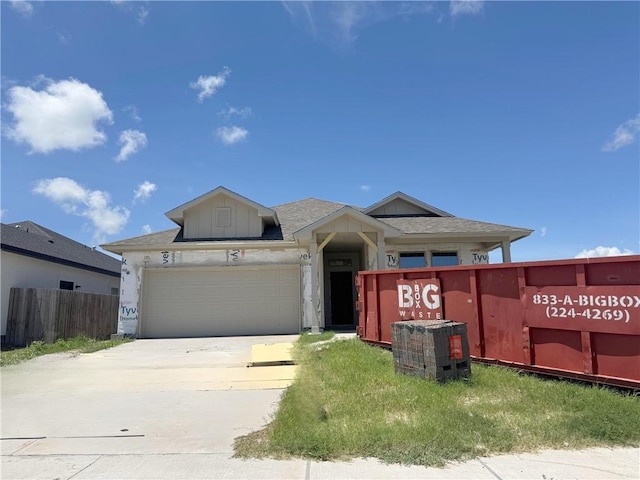 7821 Spiderman Dr, Corpus Christi, TX 78414 - view of front of property with an attached garage, concrete driveway, and a shingled roof
