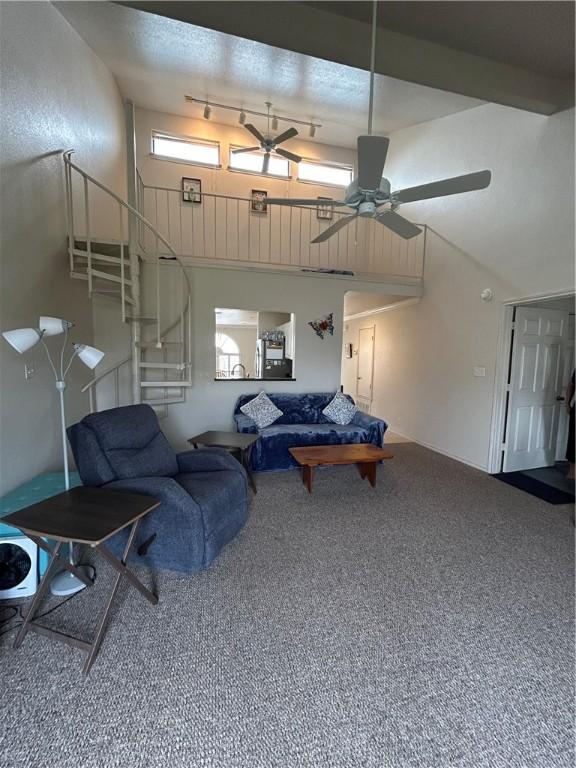 bedroom with high vaulted ceiling and carpet flooring