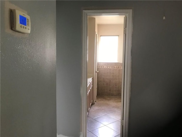 5026 Graford Pl, Corpus Christi, TX 78413 - corridor with light tile patterned flooring and tile walls