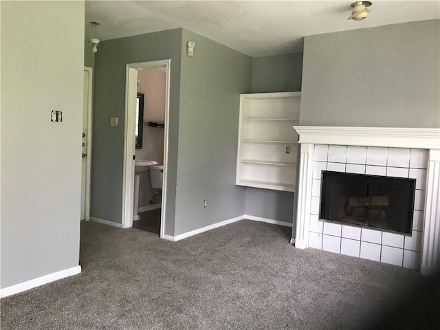 5026 Graford Pl, Corpus Christi, TX 78413 - unfurnished living room with carpet flooring and a tiled fireplace