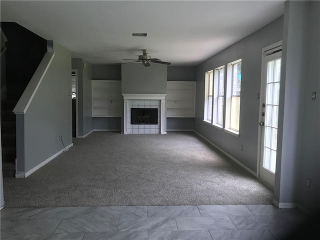 5026 Graford Pl, Corpus Christi, TX 78413 - unfurnished living room with carpet flooring, a ceiling fan, and a tiled fireplace