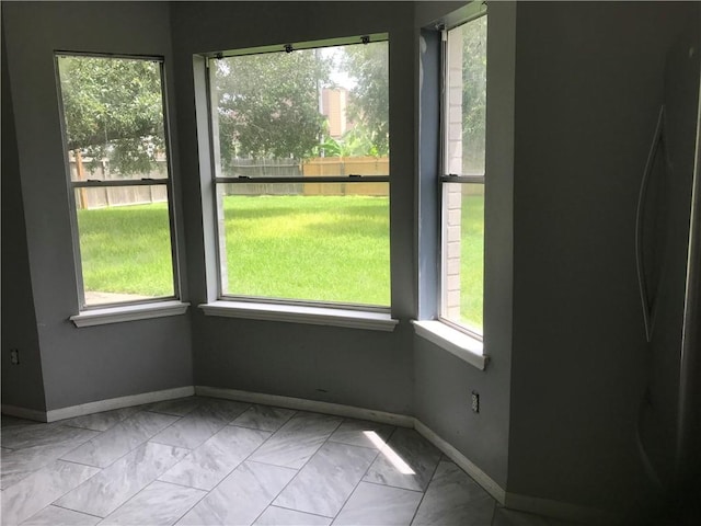 5026 Graford Pl, Corpus Christi, TX 78413 - unfurnished dining area with baseboards and marble look tiles