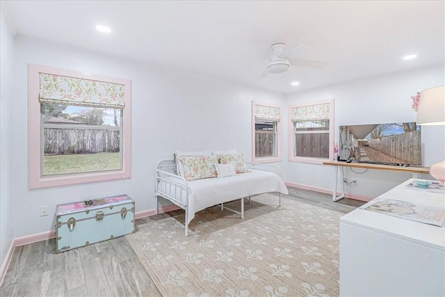 bedroom featuring ceiling fan and light hardwood / wood-style flooring