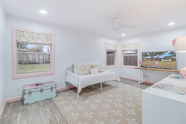 bedroom with ceiling fan and light wood-type flooring